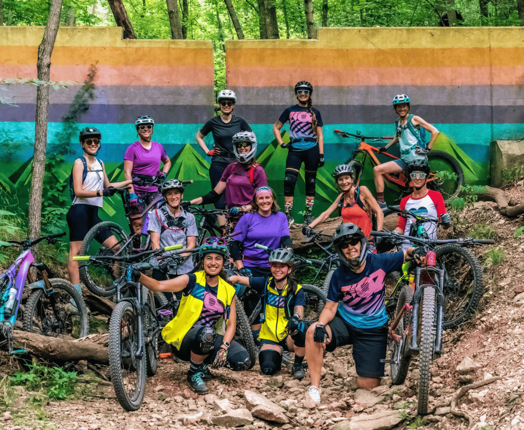 Group of cyclists posing for a mountain biking event captured by Trippool Media’s videography services in Northwest Arkansas.